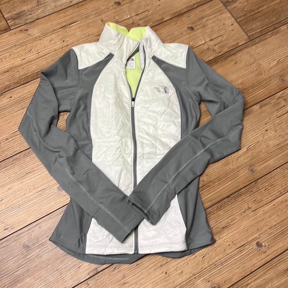 Women's North Face zip up running jacket size XS. Excellent condition.